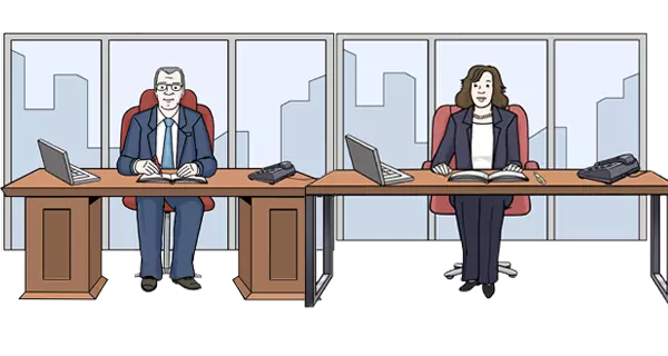 Der Direktor und die Direktorin sitzen an ihrem Schreibtisch